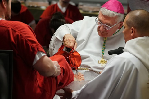 Bishop Zubik washes an inmate's feet on Holy Thursday at Allegheny County Jail.